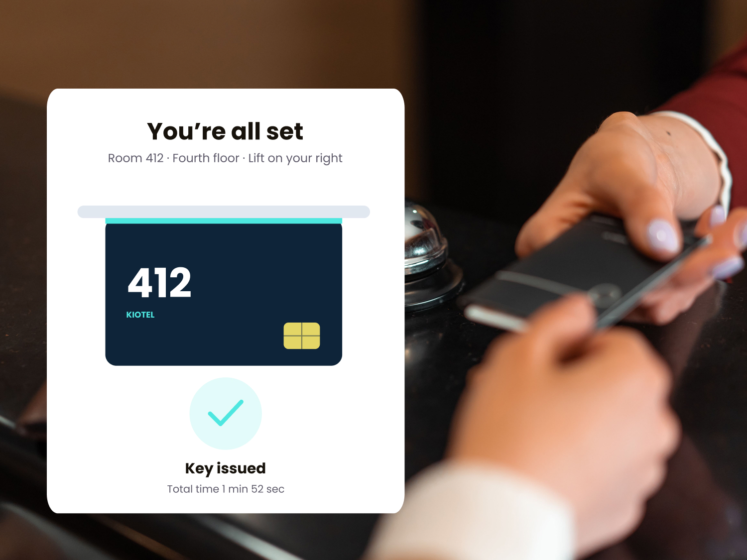 Kiosk screen confirming check-in with a room key being dispensed