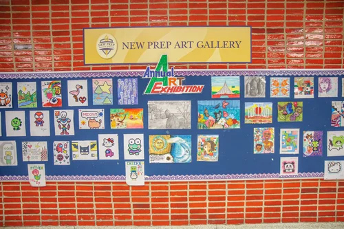 Student artwork displayed on New Prep Art Gallery annual exhibition board
