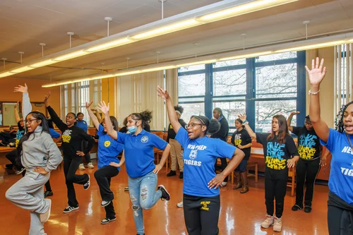 New Prep Tigers students dancing together in a school classroom