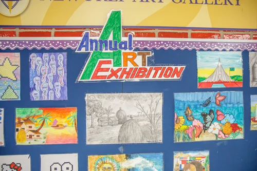 Student artwork displayed on Annual Art Exhibition bulletin board