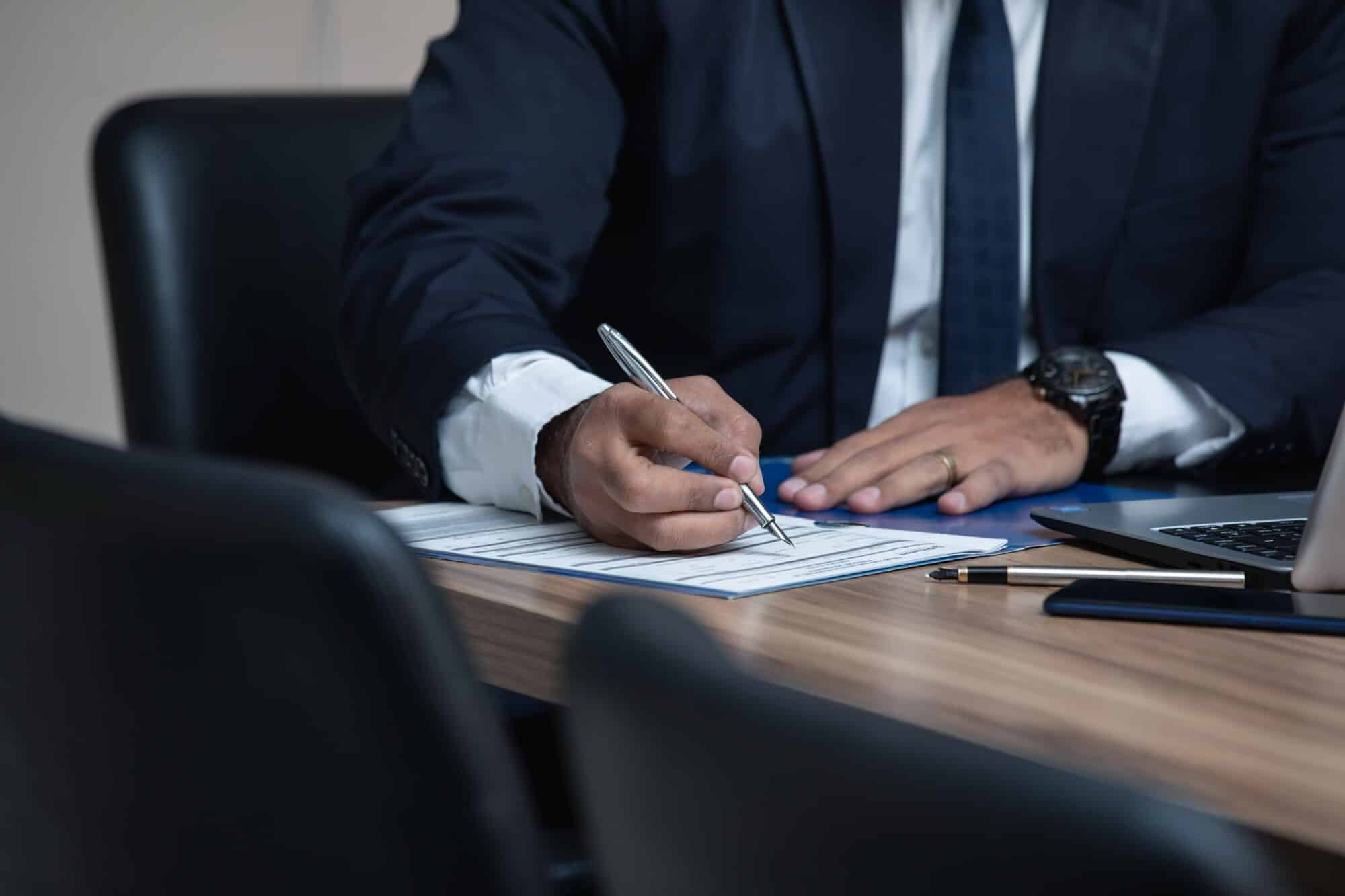 man on study table - How To Dissolve An LLC In Oregon