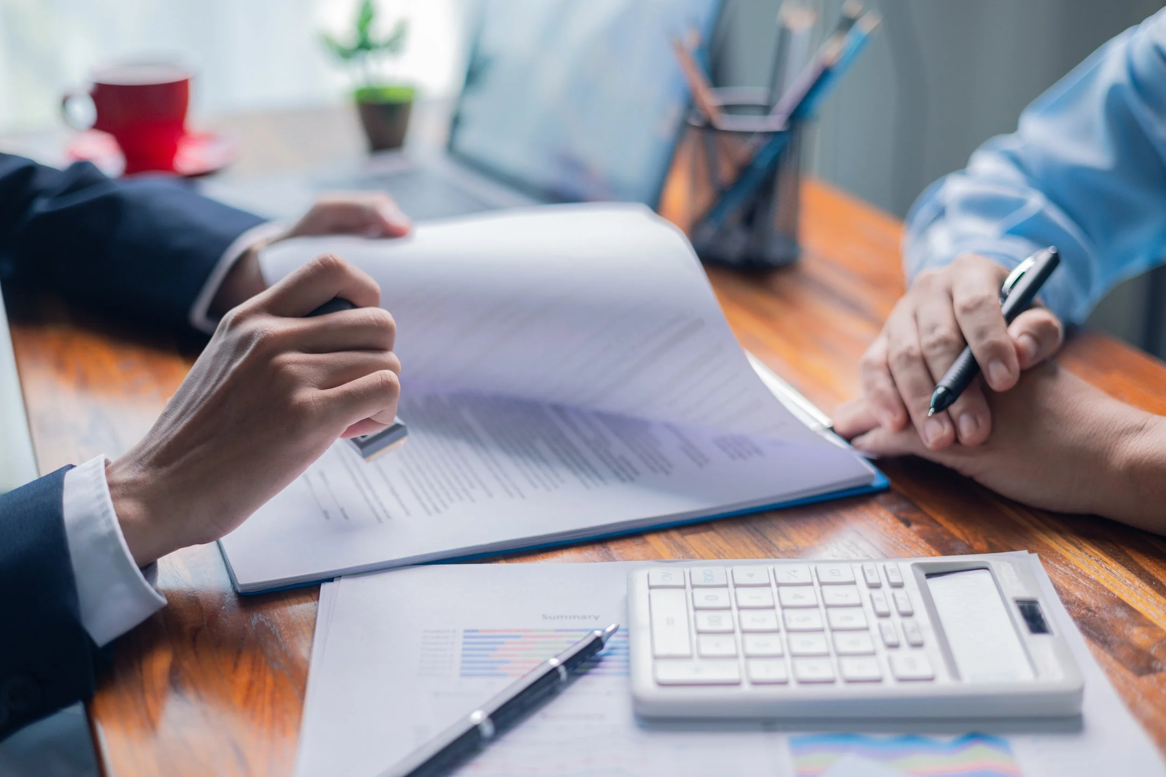 person putting a stamp - How to Dissolve an LLC in Arkansas