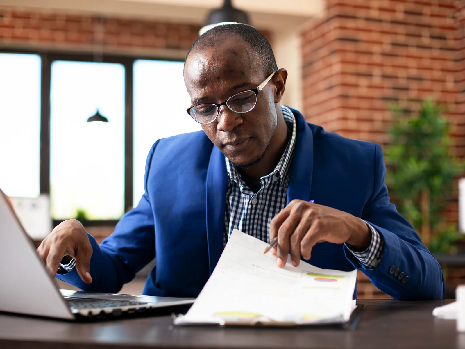 person looking at document - how to dissolve an llc in delaware