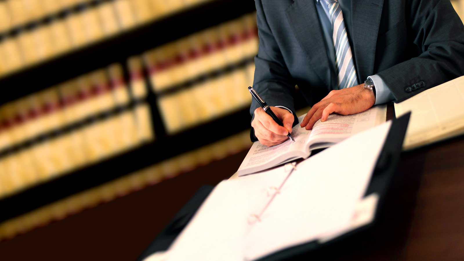 man signing - How To Dissolve An LLC In Texas