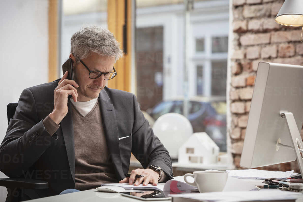 man on a phone call - How To Dissolve An LLC In Texas