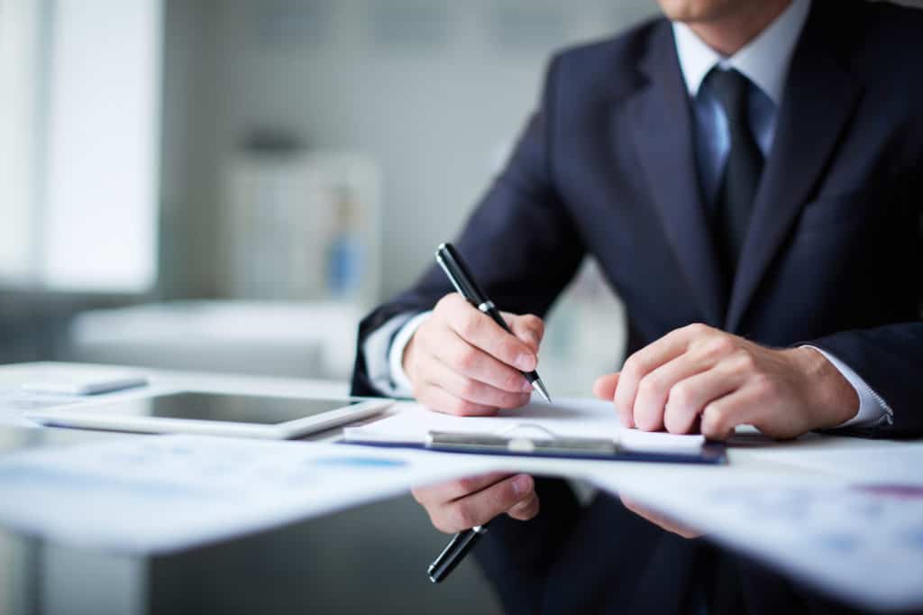 man writing - How to Dissolve an LLC in Hawaii 