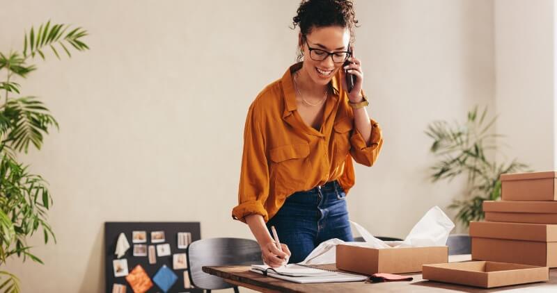 woman talking on a phone - How to Dissolve an LLC in Hawaii 