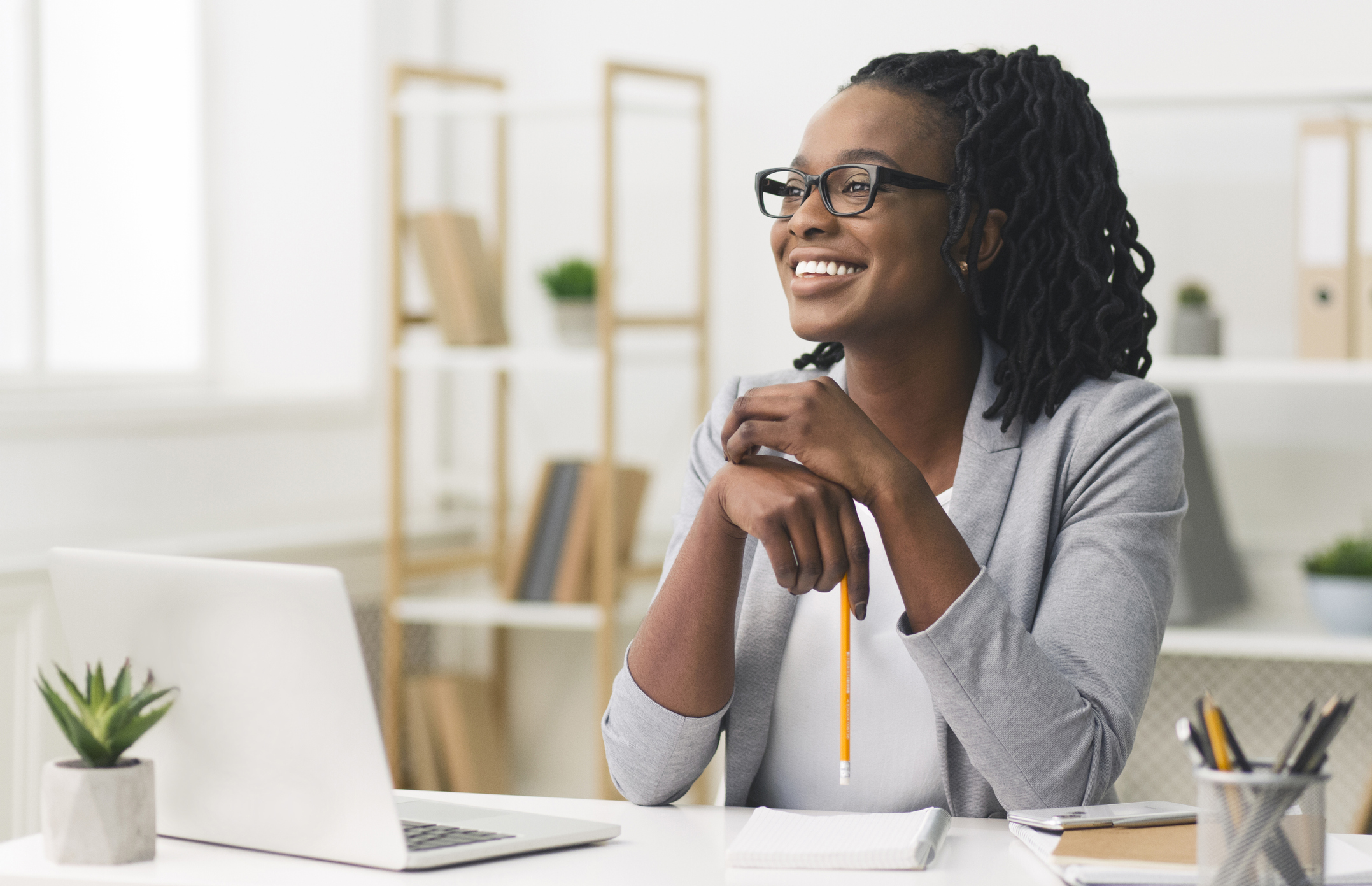 woman smiling - How to Dissolve an LLC in Idaho  