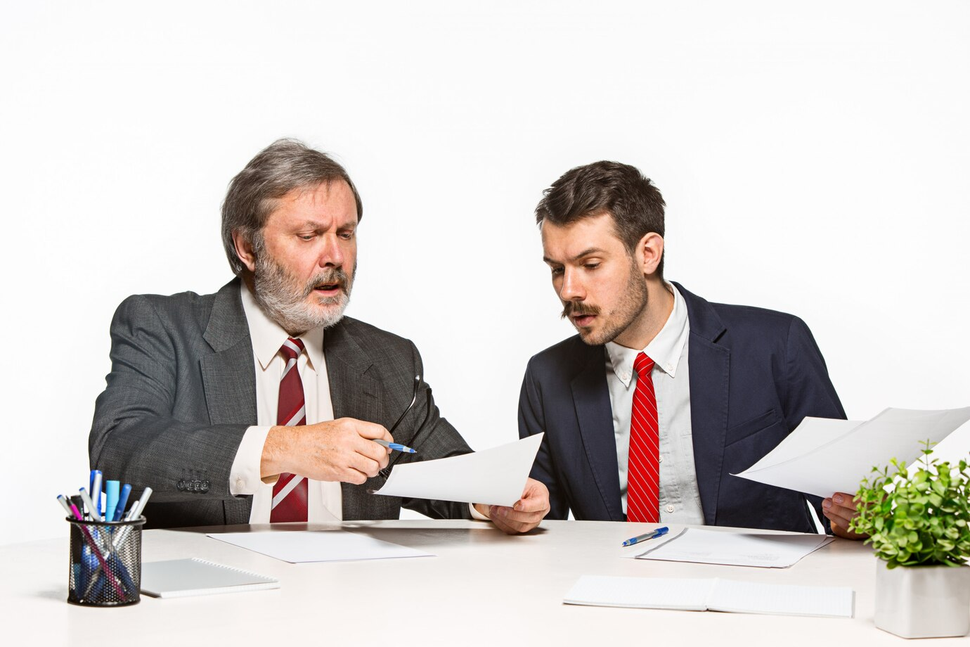 man with dozen documents - How to Dissolve an LLC in Illinois