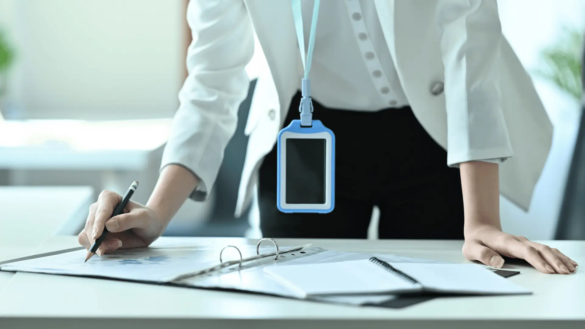 person going over multiple documents - How to Dissolve an LLC in Illinois