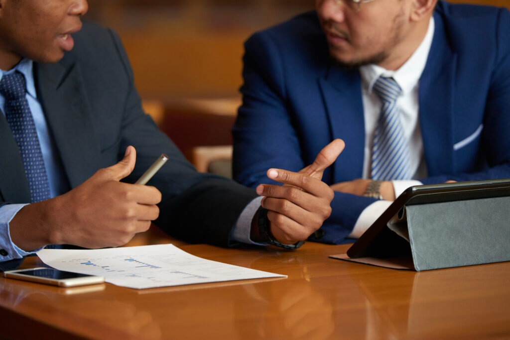 men in suits talking - How To Dissolve An LLC In Louisiana 