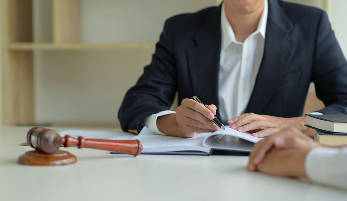 man holding a pen - How To Dissolve An LLC In Louisiana 