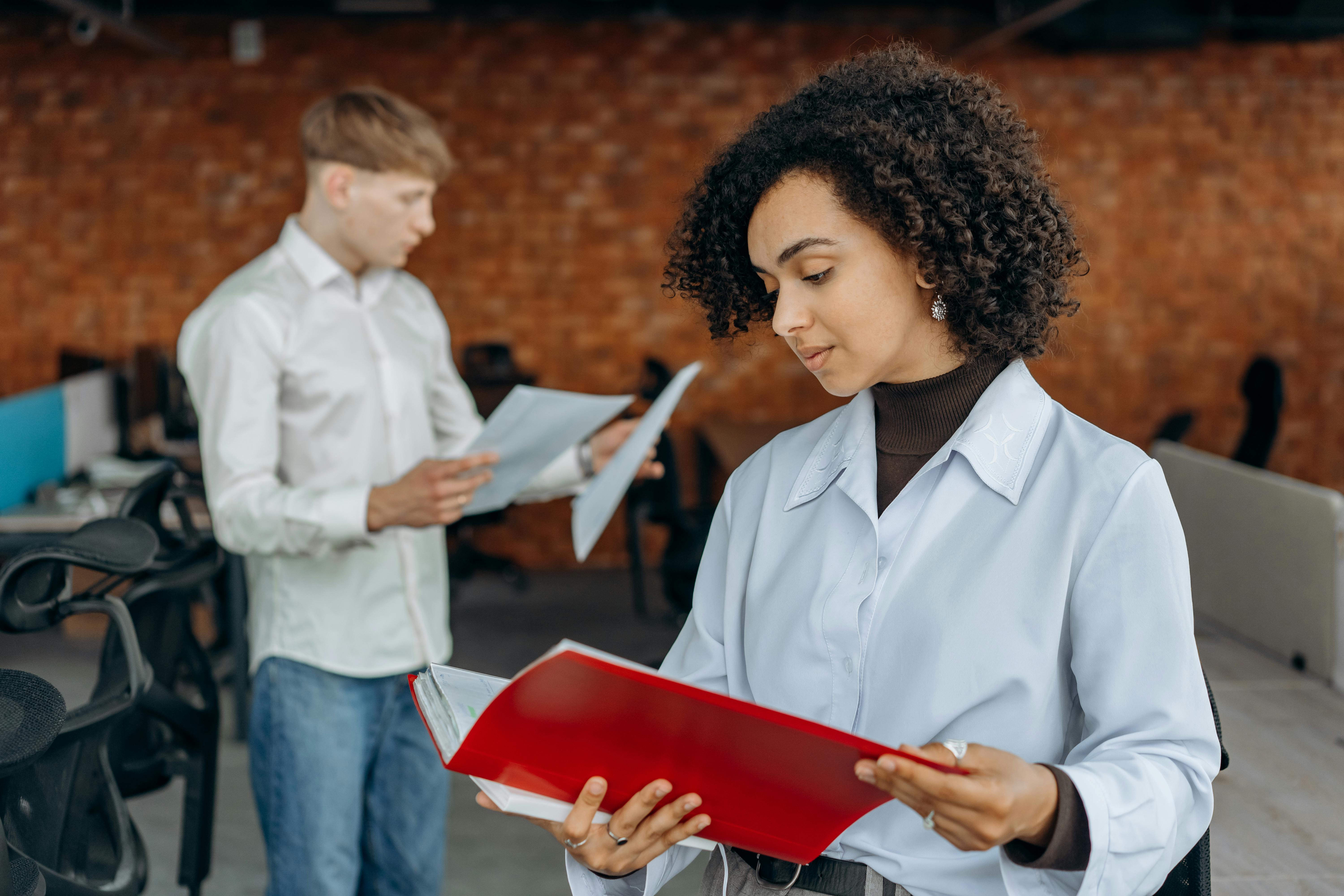 woman holding a document - How To Dissolve An LLC In Maryland