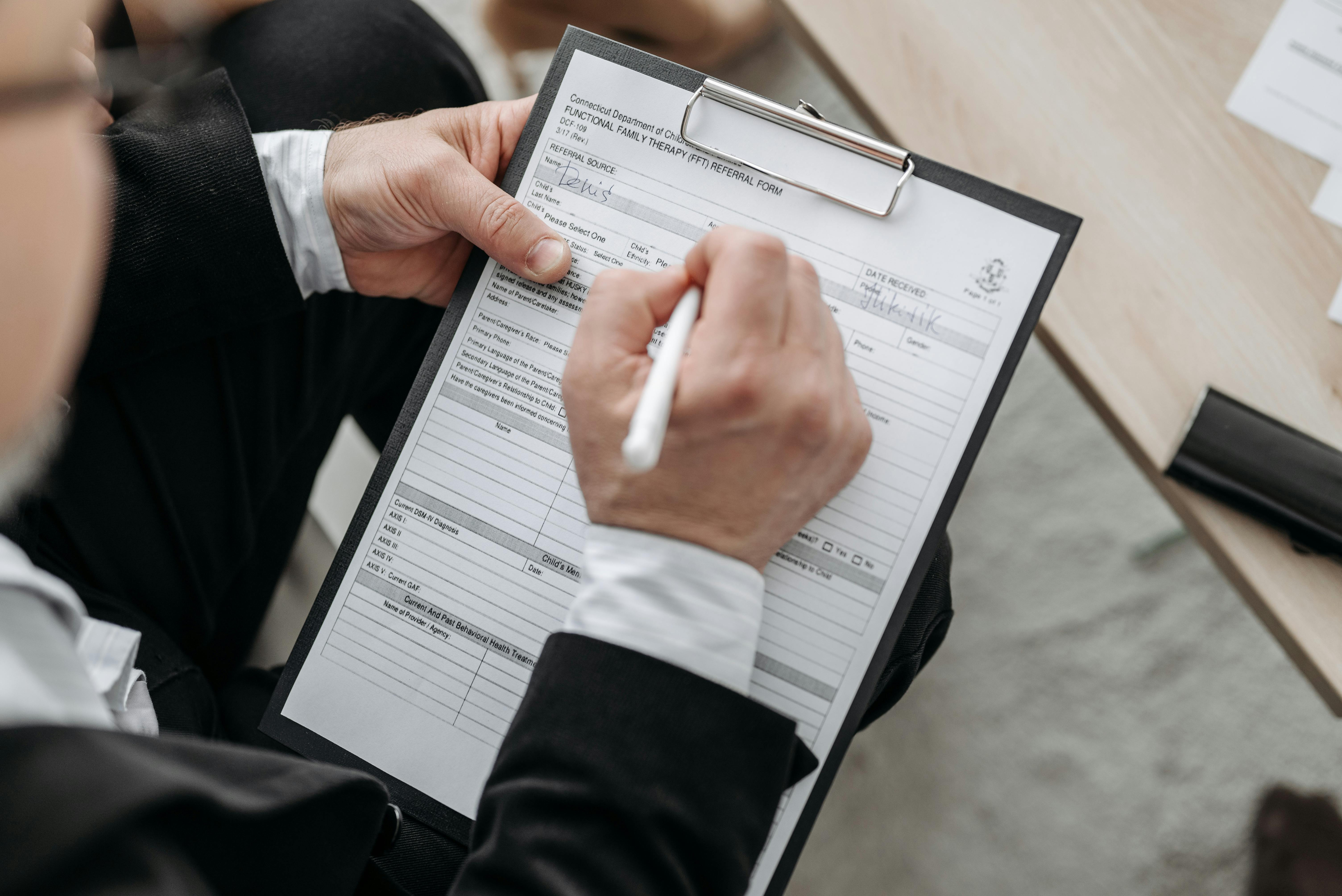 man wearing a black suit - How To Dissolve an LLC in New Mexico