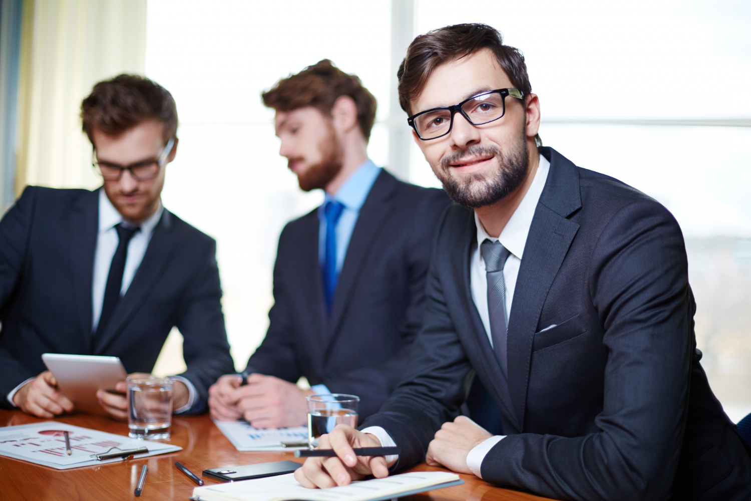 employees in a meeing - How To Dissolve an LLC in New Mexico
