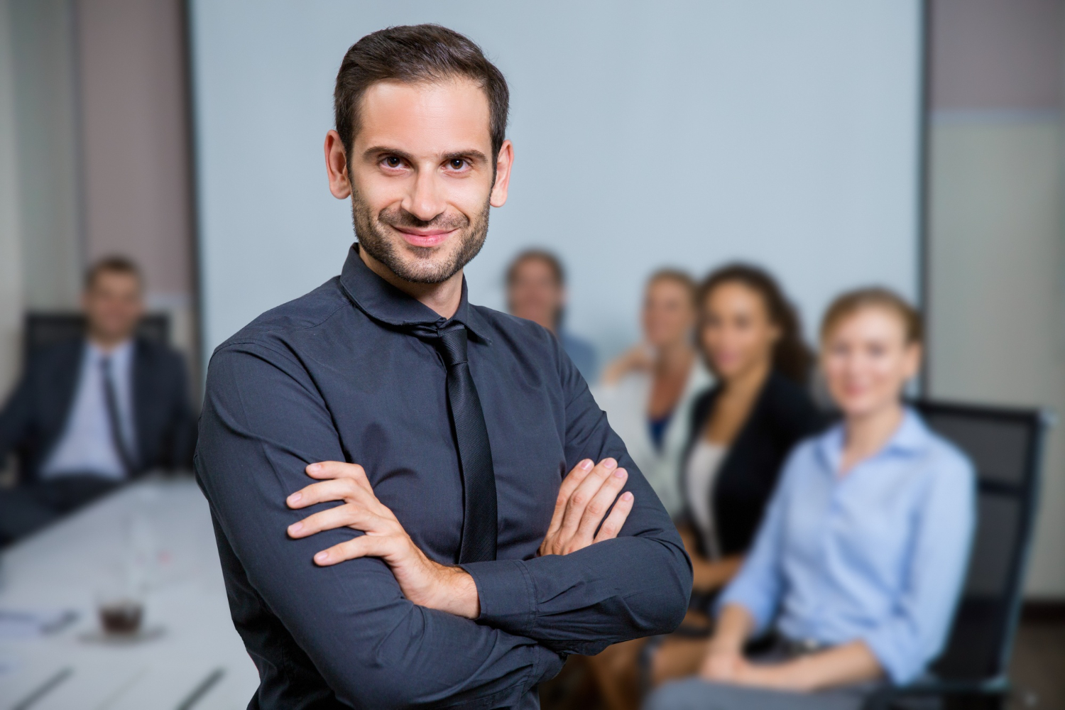 man wearing a black tie - How To Dissolve an LLC in New Mexico