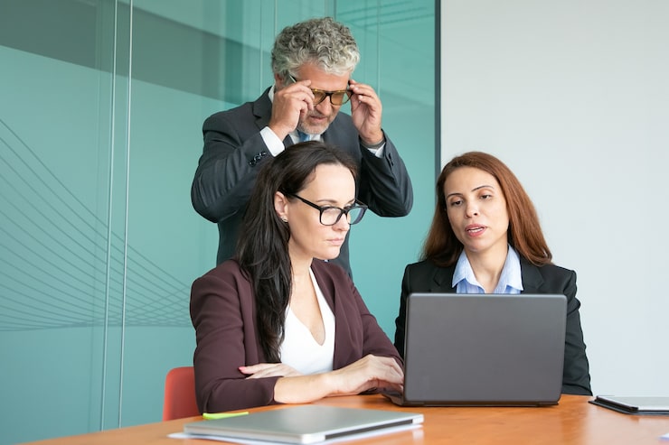 employees in a meeting - how to dissolve an llc in north carolina