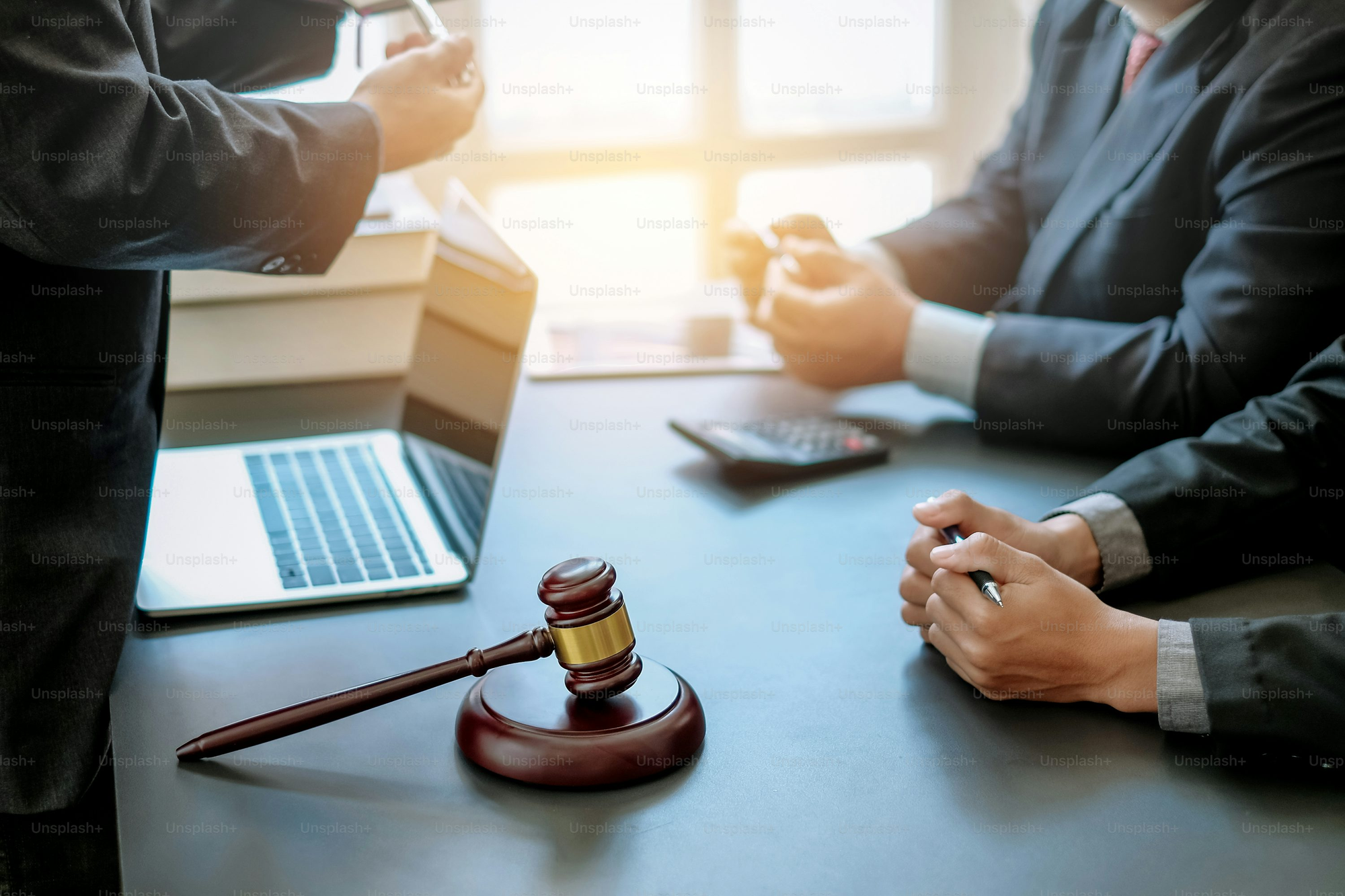 person sitting on table - How To Dissolve An LLC In Oklahoma