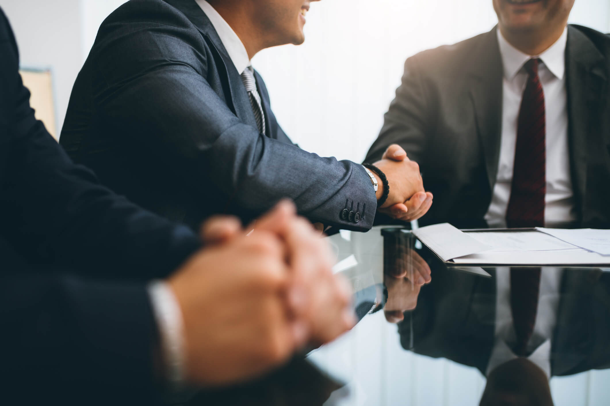 person shaking hands - How to Dissolve an LLC in Rhode Island