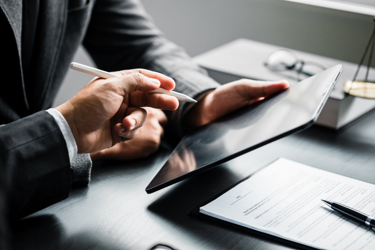person reviewing document - How To Dissolve An LLC In Texas