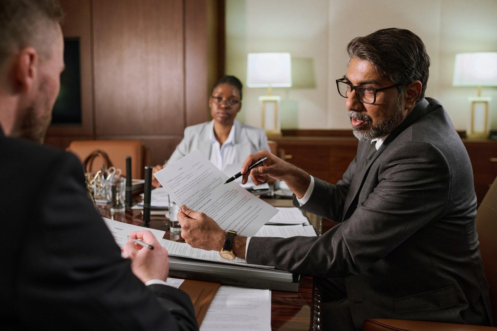 a meeting with lawyers - How To Dissolve An LLC In Utah
