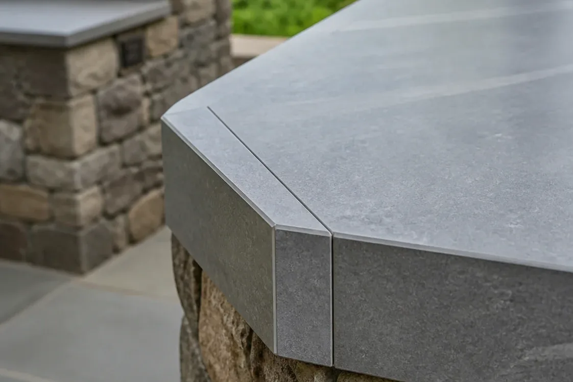 Mitered porcelain edge on an outdoor kitchen in Stratford, CT, with the pattern carried over the corner