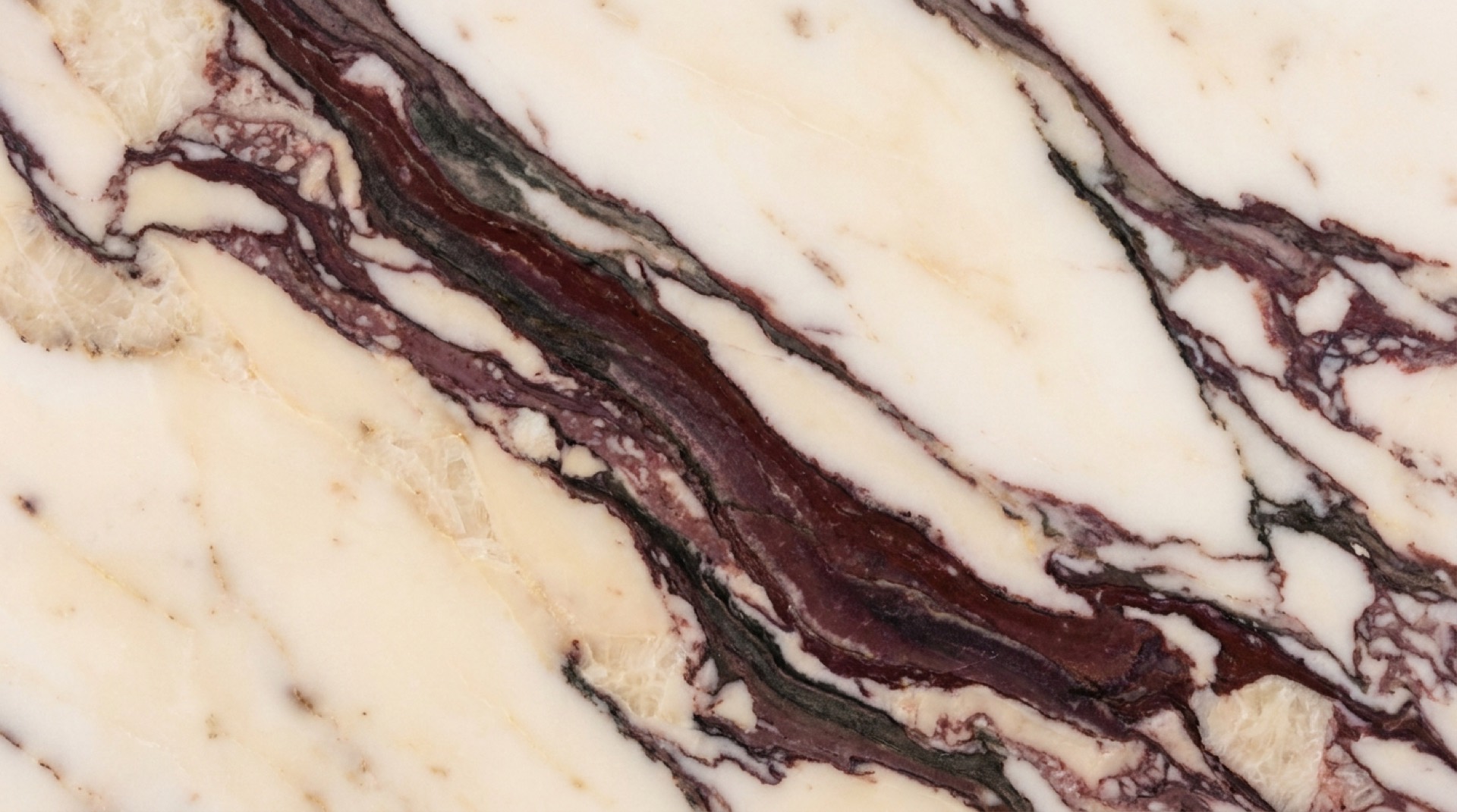 Calacatta Viola marble slab with burgundy and plum veining