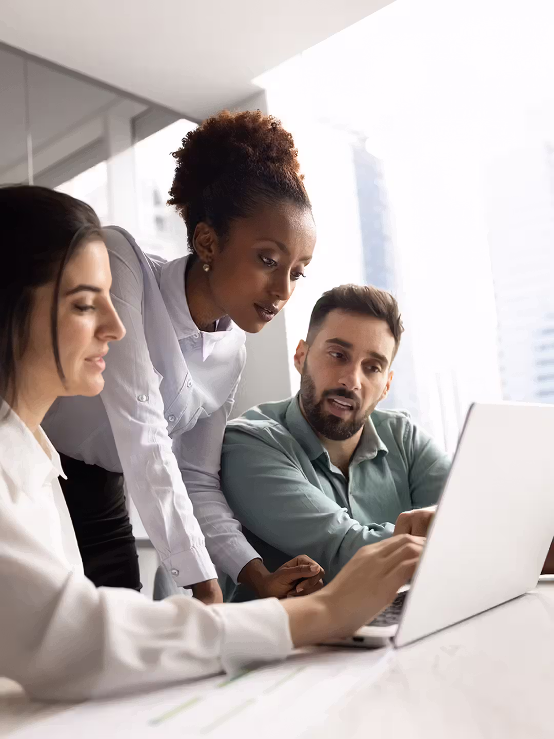 Team working together around a computer