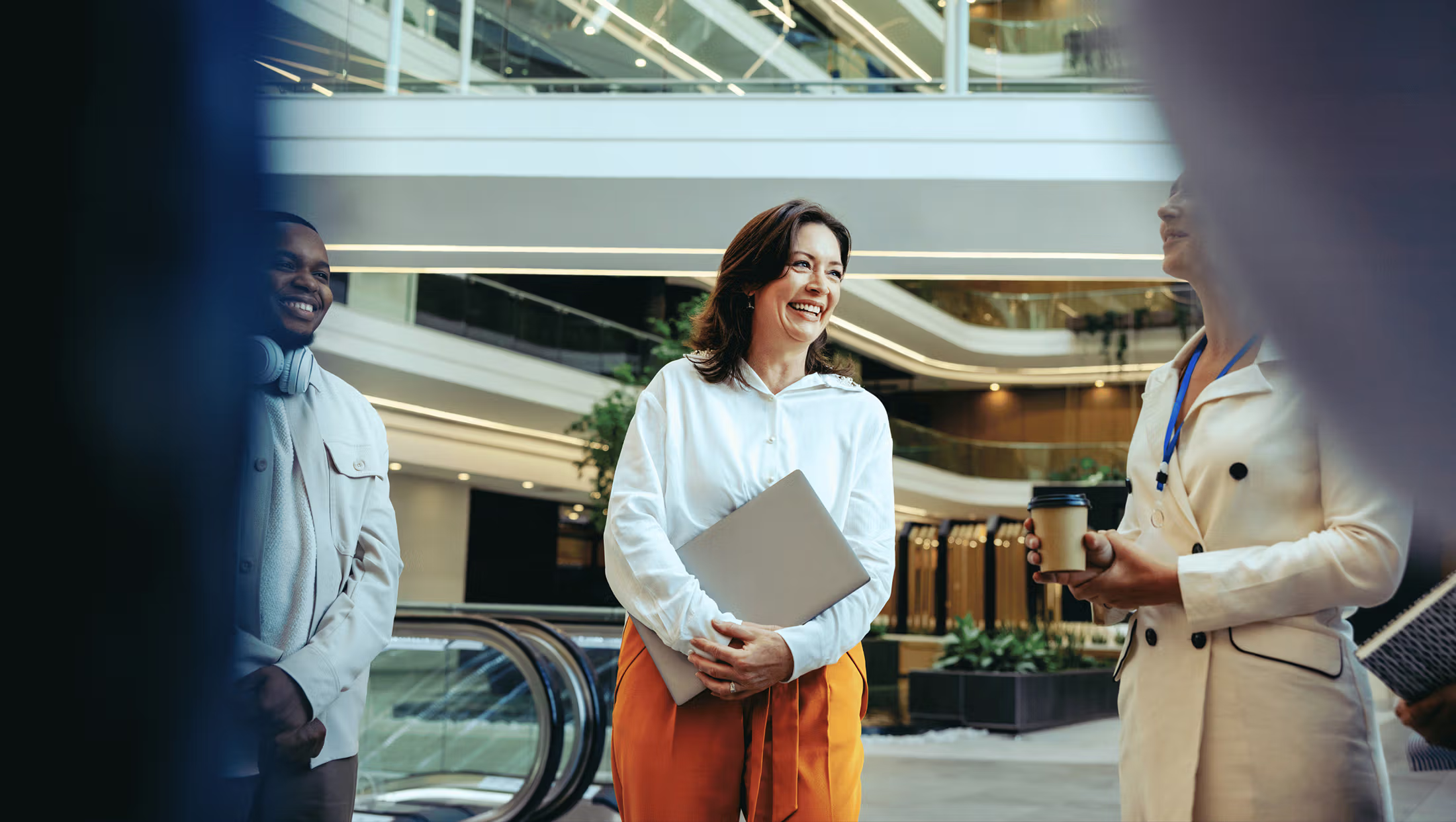 Team engaging in conversation in a open space modern office