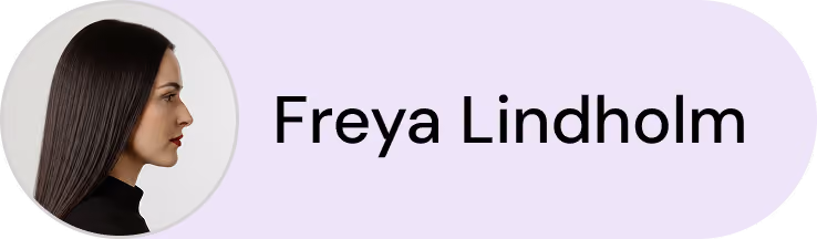 Profile photo of a woman with long dark hair in black clothing next to the name Freya Lindholm.