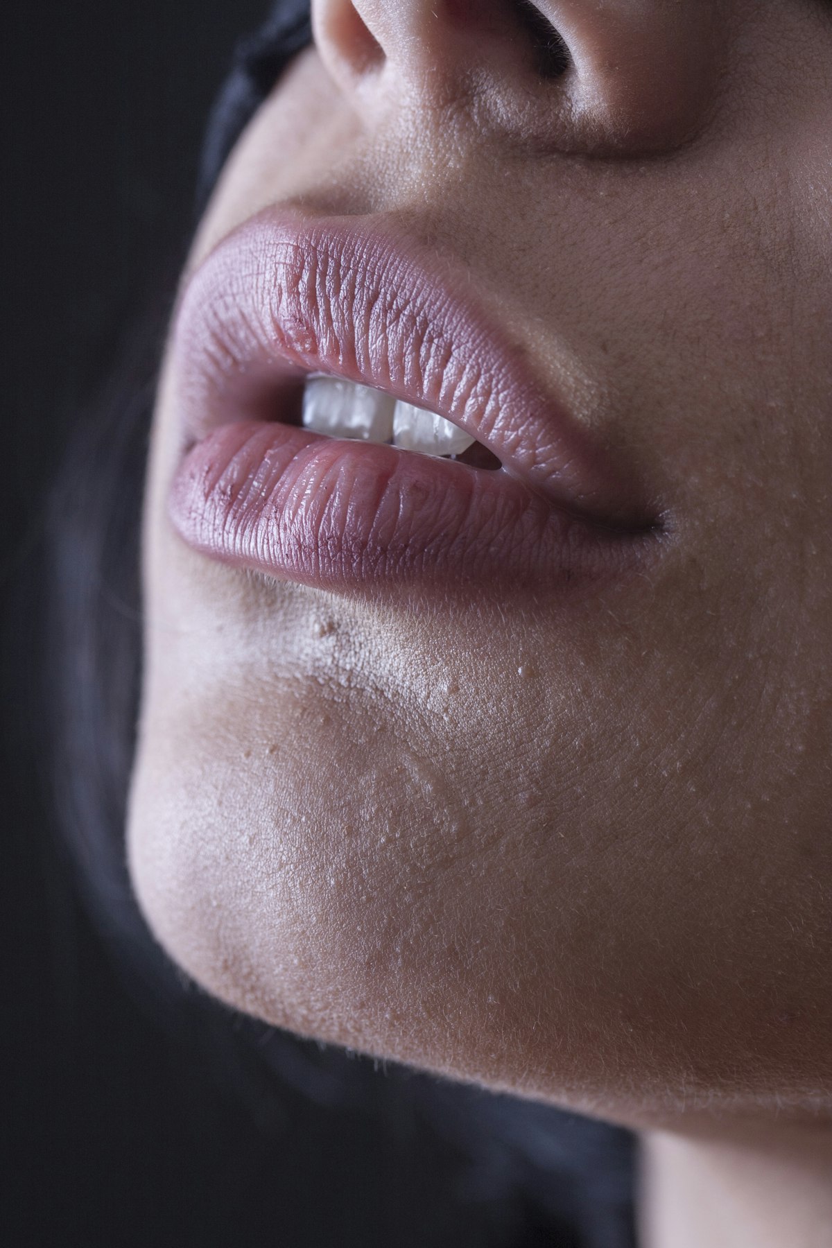 Close-up of a relaxed mouth and chin in soft, even light