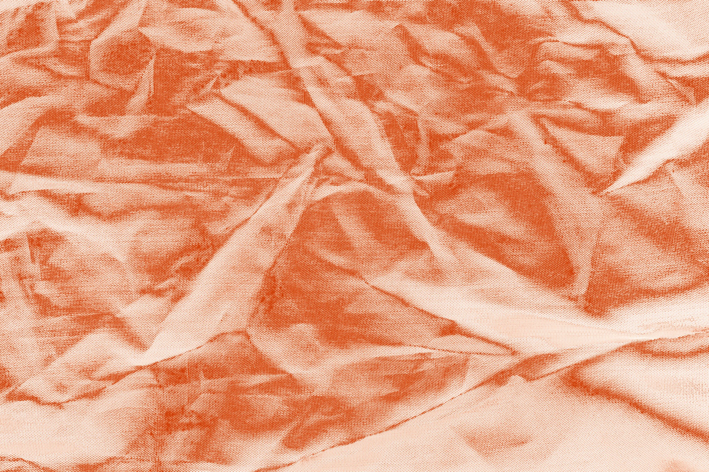 Crumpled peach satin, folded into soft shadow