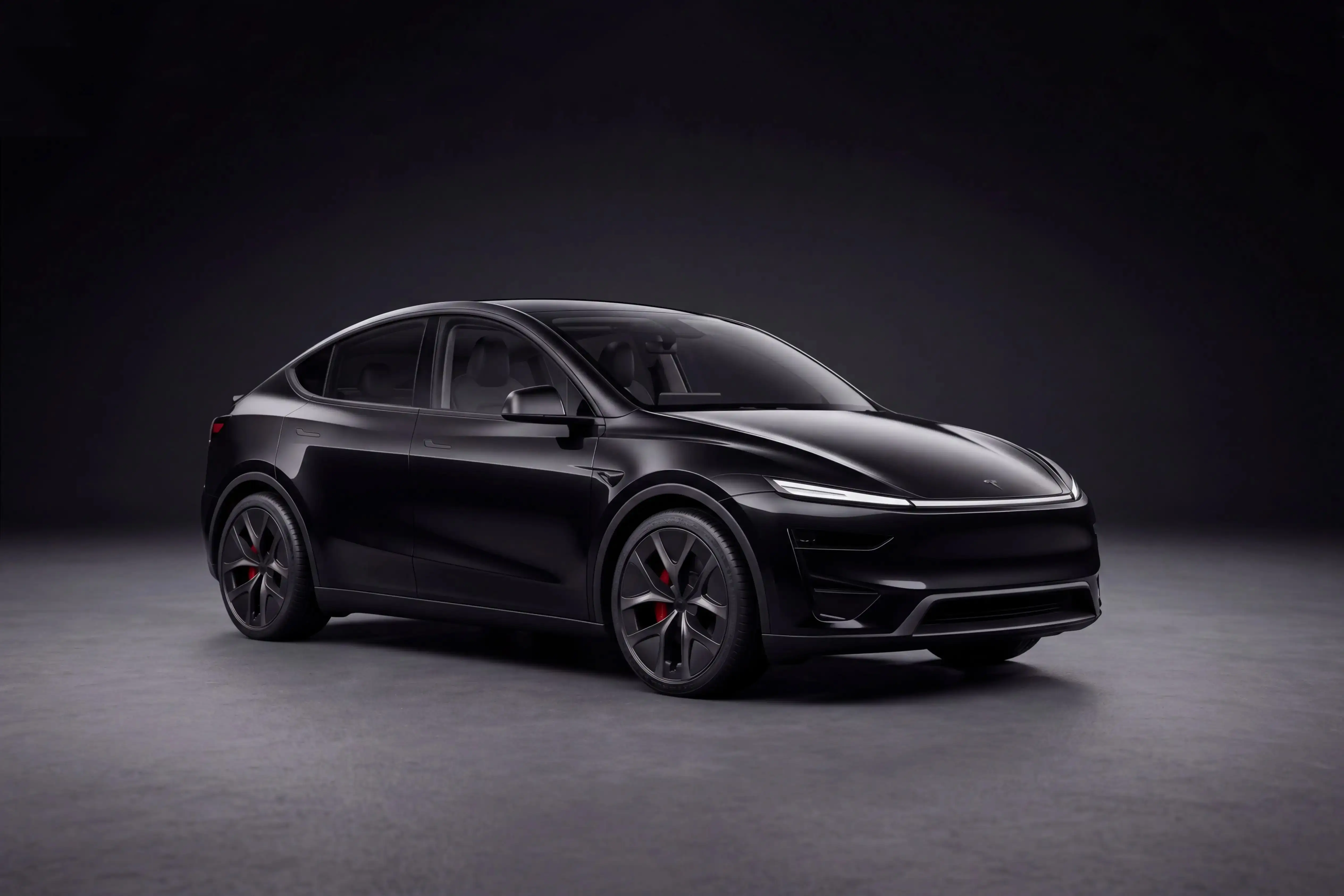 Foto profesional de un Tesla Model Y negro en un garaje de lujo oscuro