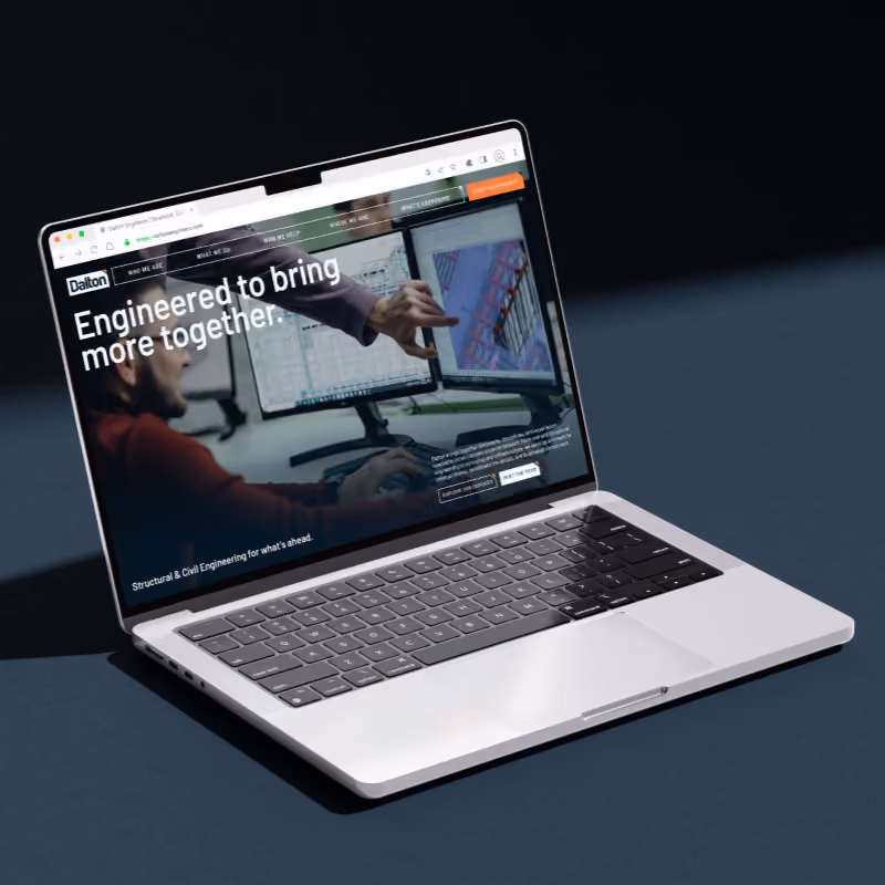 Laptop displaying Dalton Engineers website homepage.
