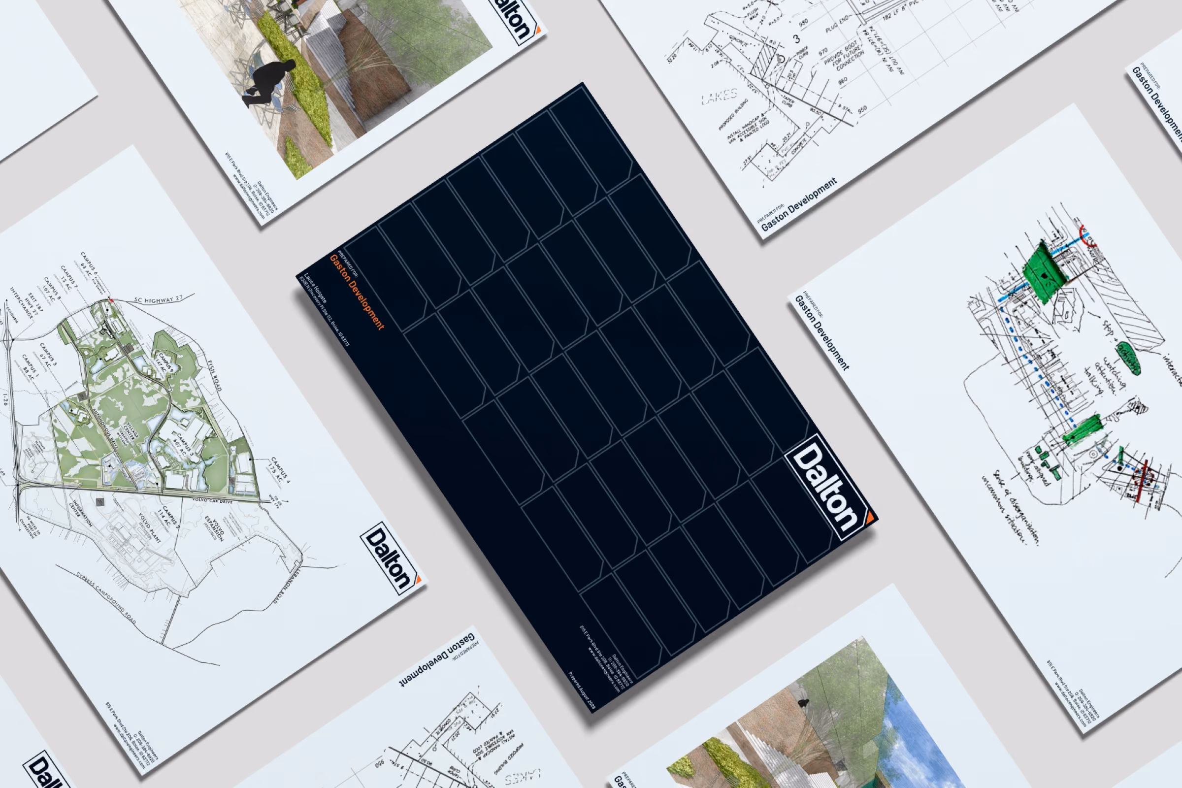 Top view of several Dalton Engineers technical presentation documents spread out.