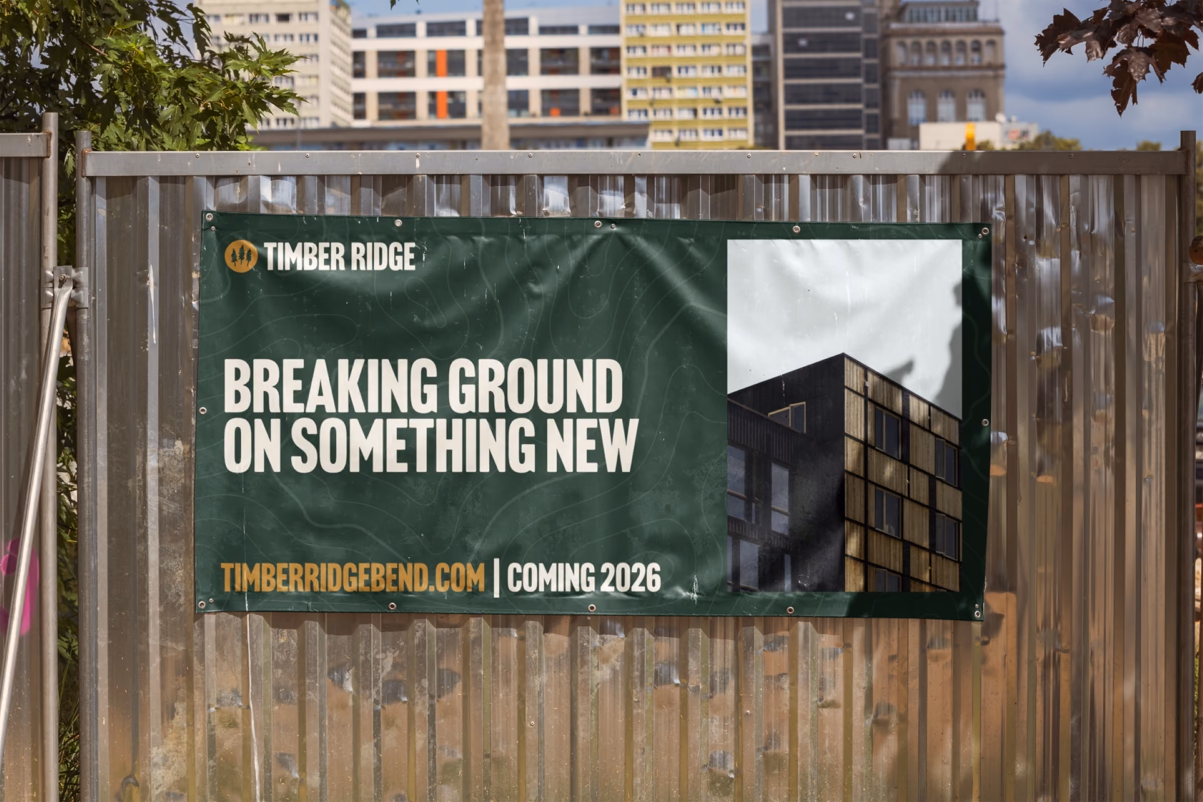 Outdoor banner on a corrugated metal fence showing Timber Ridge branding.