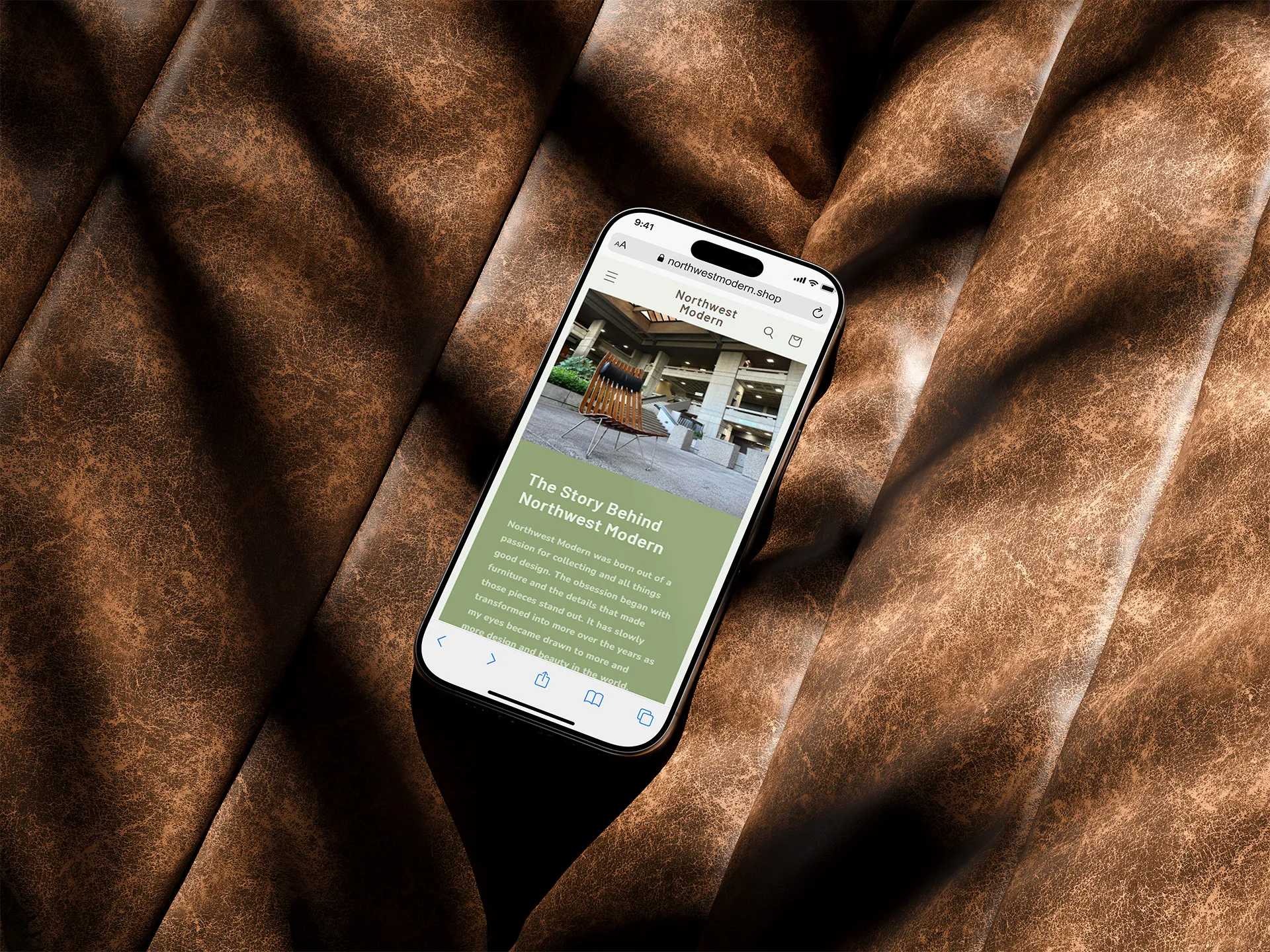 Image of a phone on a leather couch open to the NW Modern website.