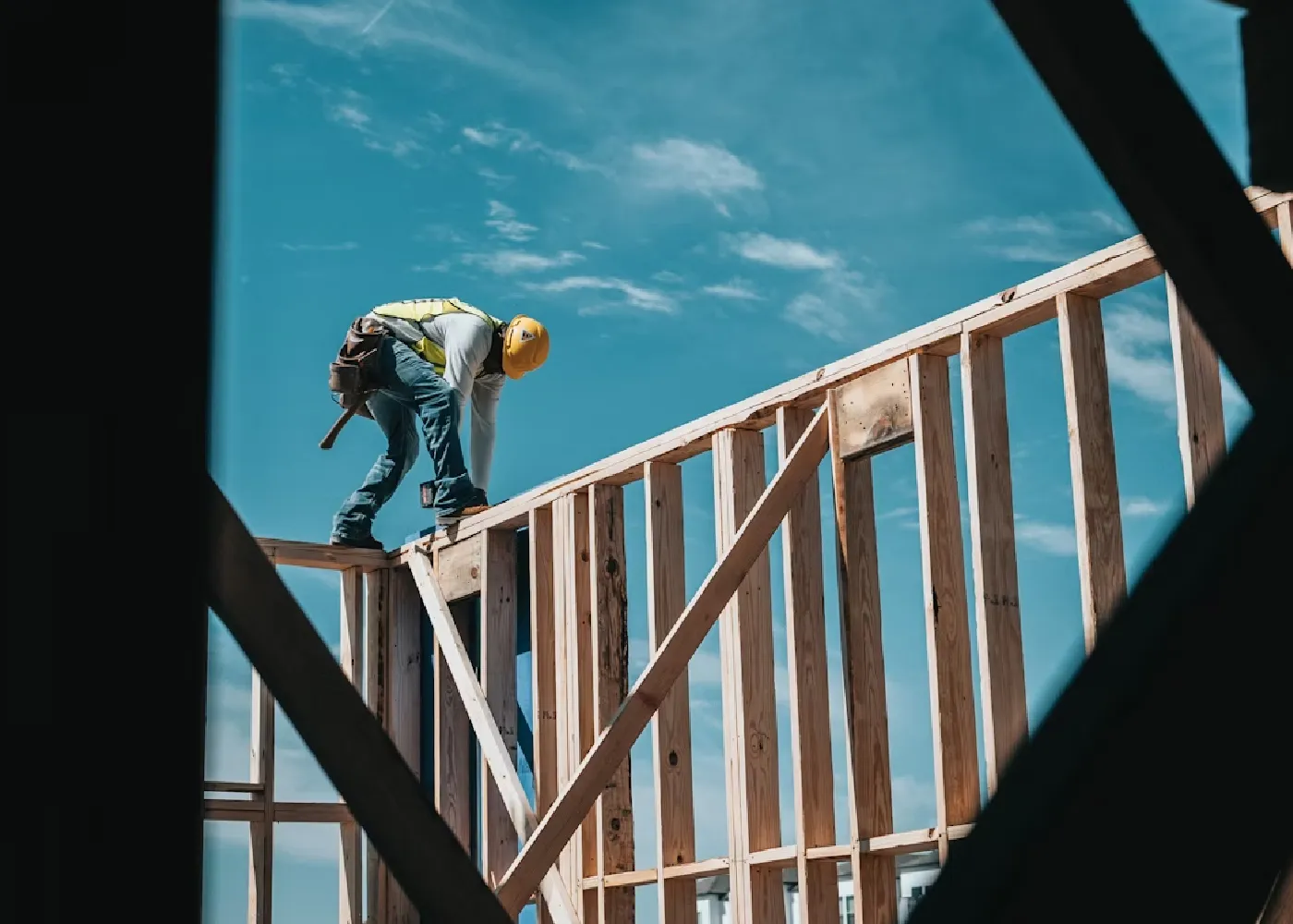 Image on contractor on framing of a house.