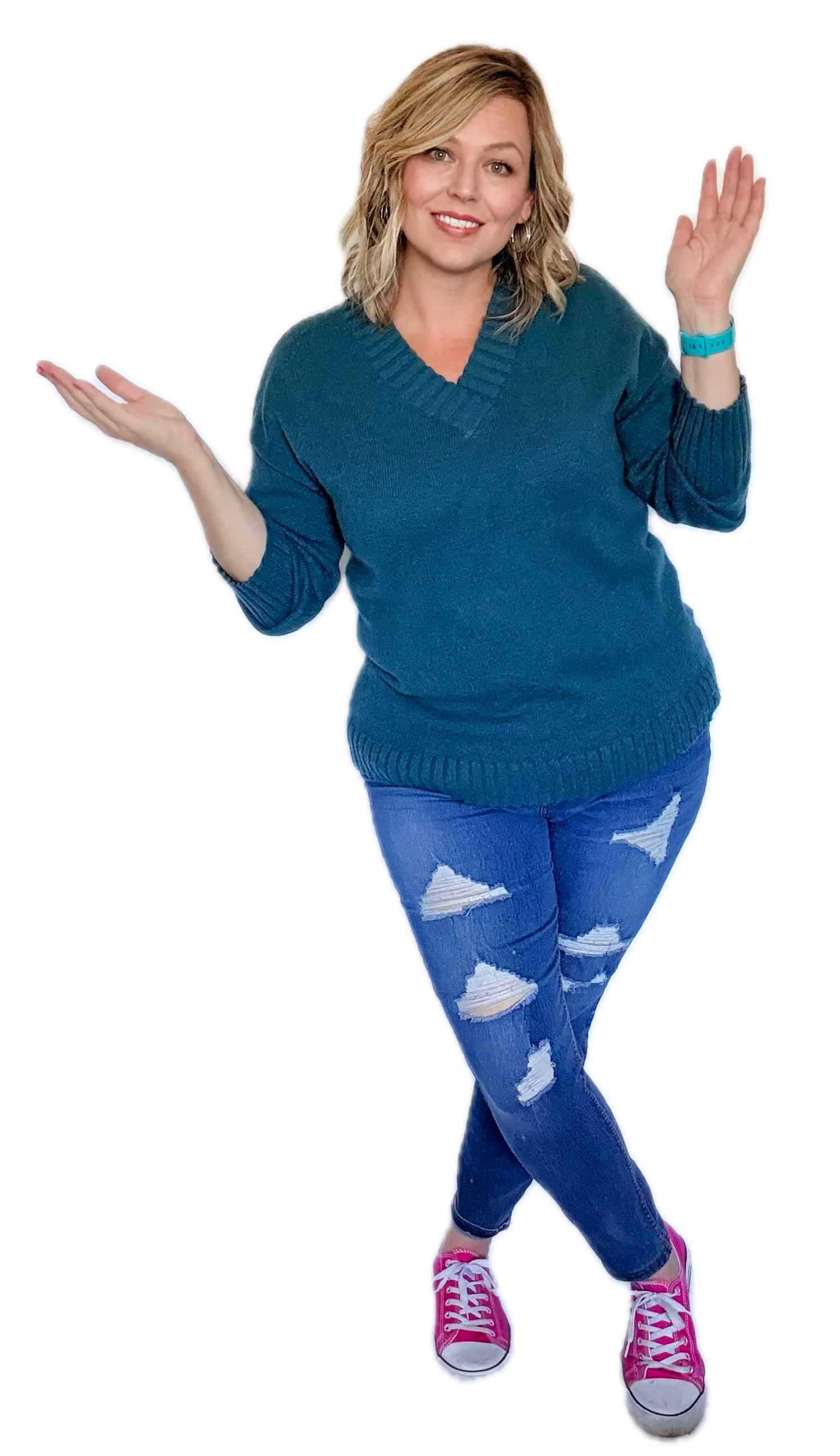 Samantha Markey smiling woman wearing teal sweater and ripped blue jeans with pink sneakers