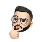 Male avatar with glasses and beard holding chin in a thinking pose.