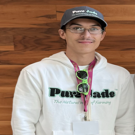 Brody in a Pure Jade hoodie and cap