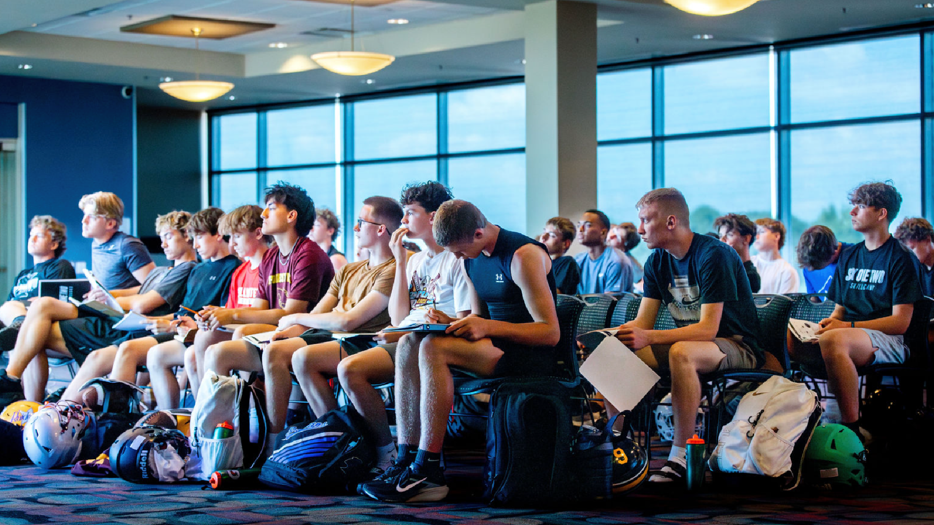 Young quarterbacks attend a classroom learning session at 612 Quarterbacks Academy in Edina, Minnesota.