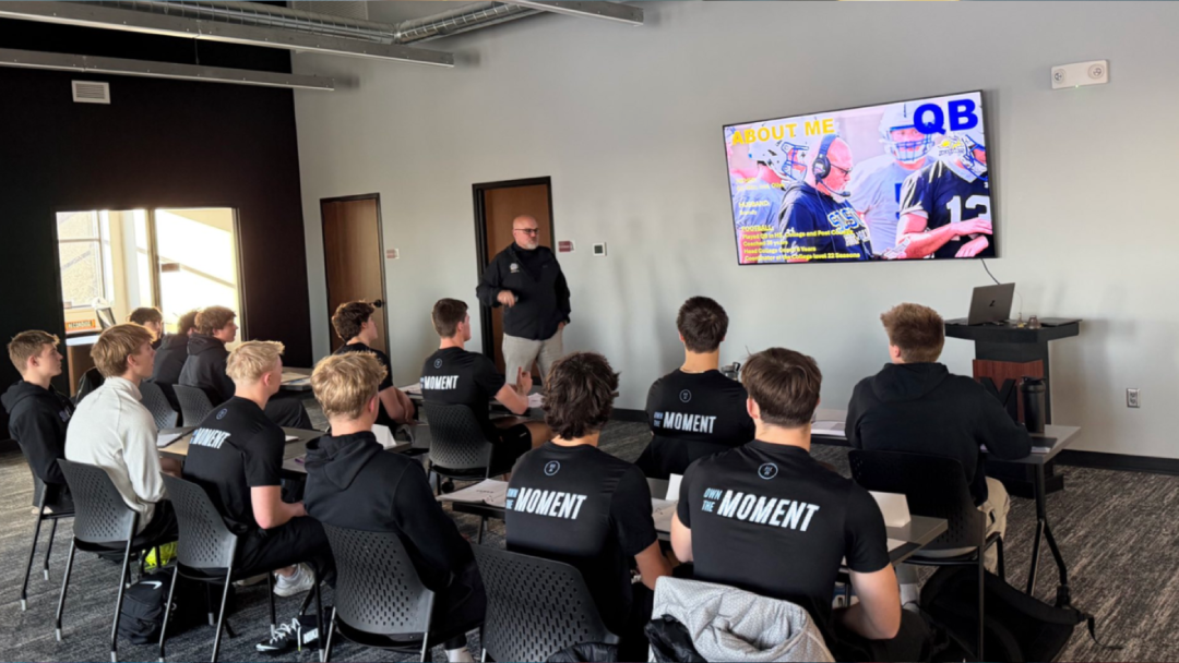Young quarterbacks attend a classroom coaching session at 612 Quarterbacks Academy in Edina, Minnesota.