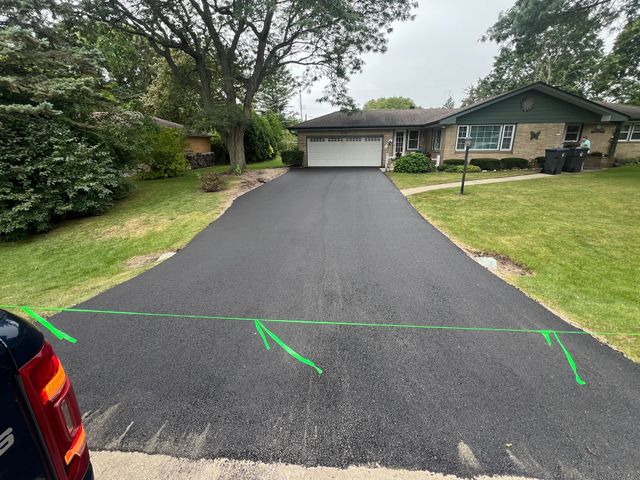 Completed residential asphalt driveway