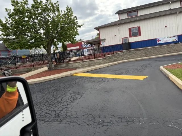 Sealcoated parking lot beside a commercial building