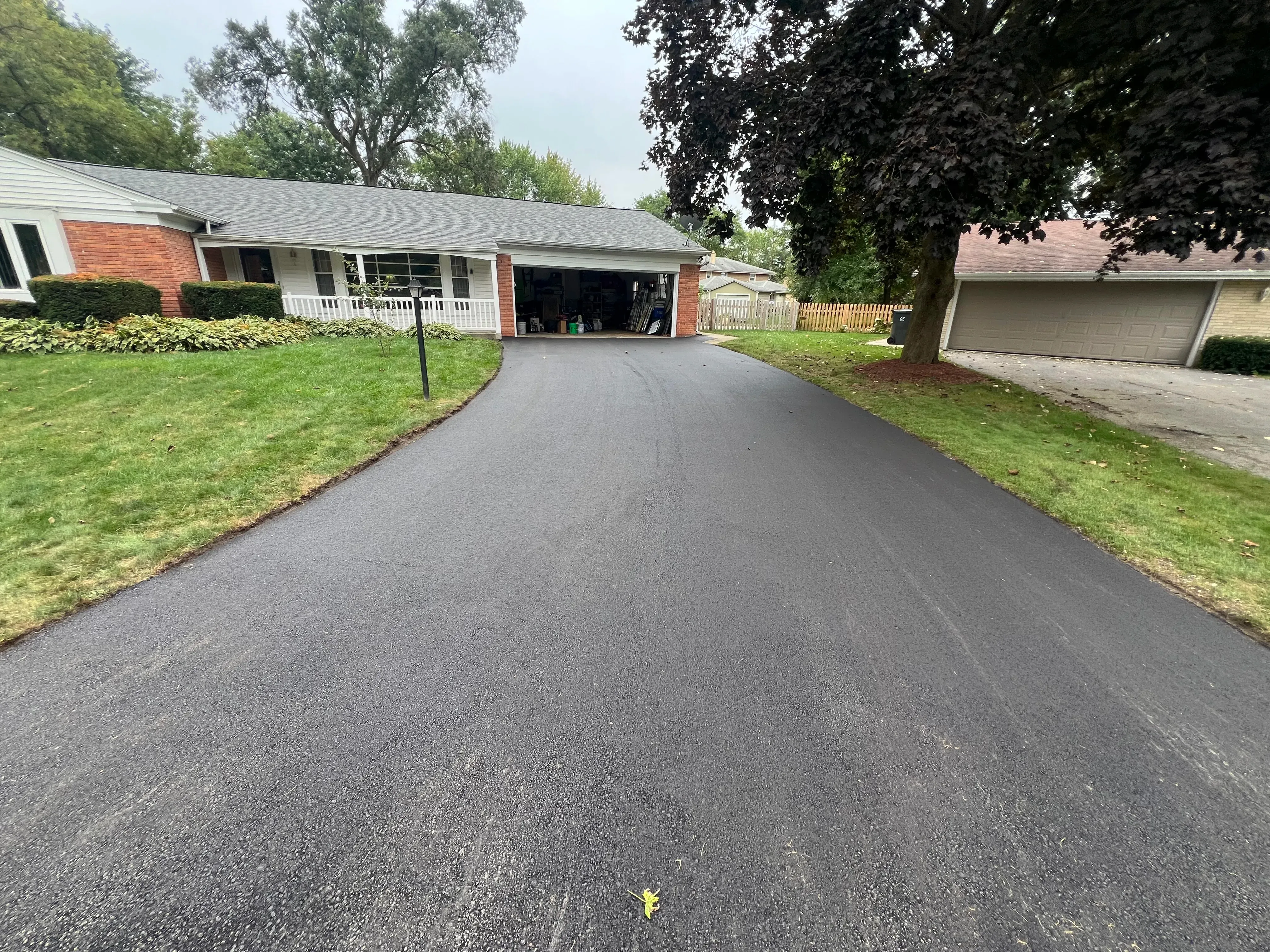Finished asphalt driveway ready for the final walkthrough
