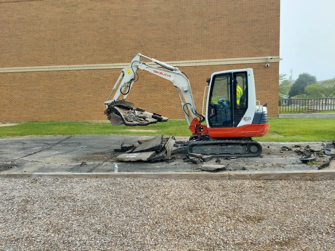The Purpose Contracting Asphalt crew working together on site