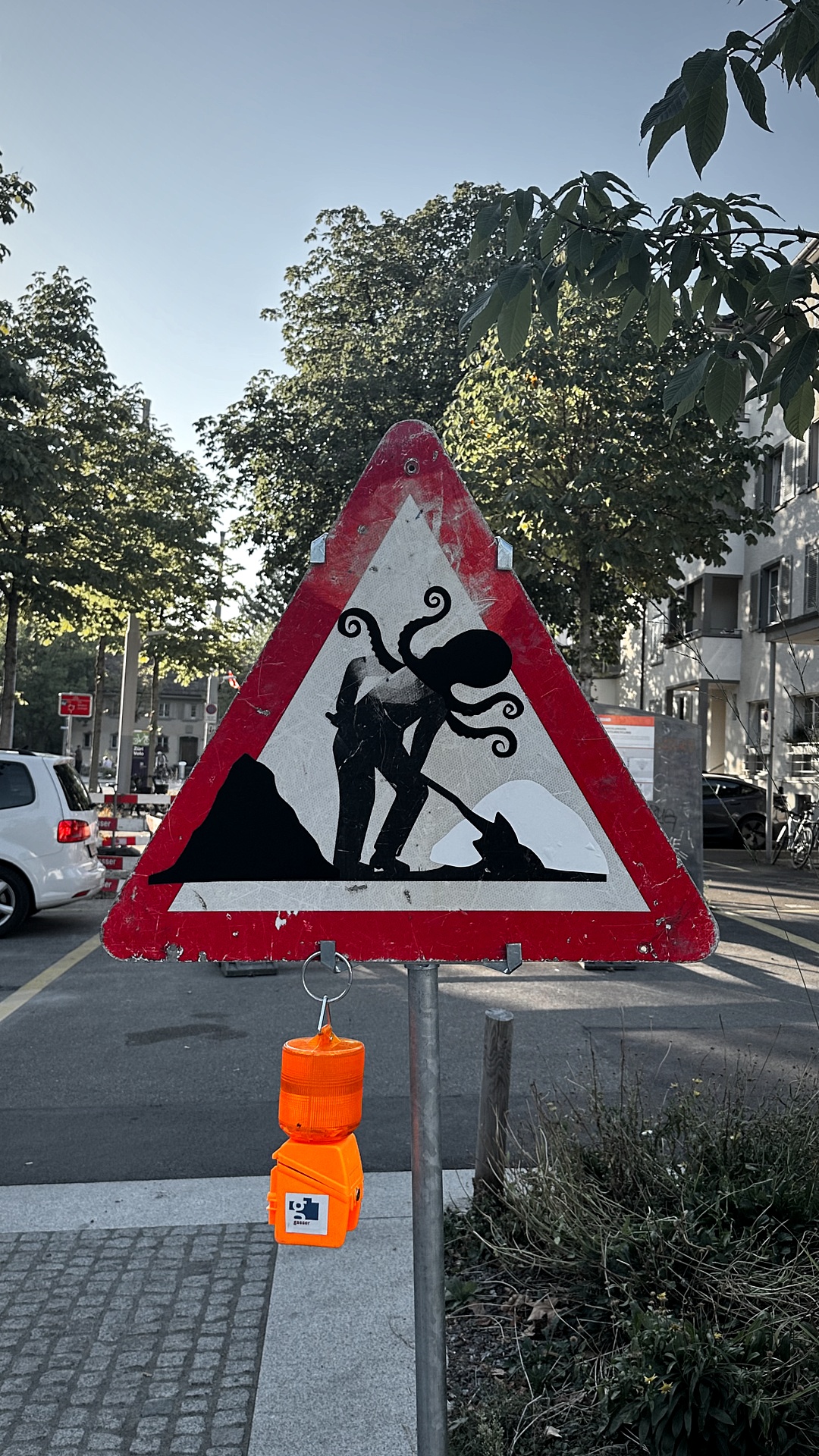 The octopus: tentacles curling out of the worker's head