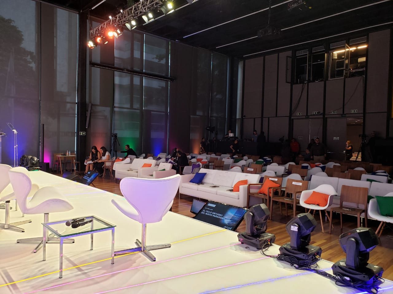 ENEL · 2019 — A meeting room lined in yellow, with a mezzanine walkway above.