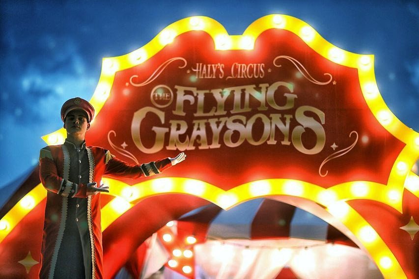 Netflix · 2019 · Haly's Circus — A lit circus marquee with a scalloped edge and chase lights.